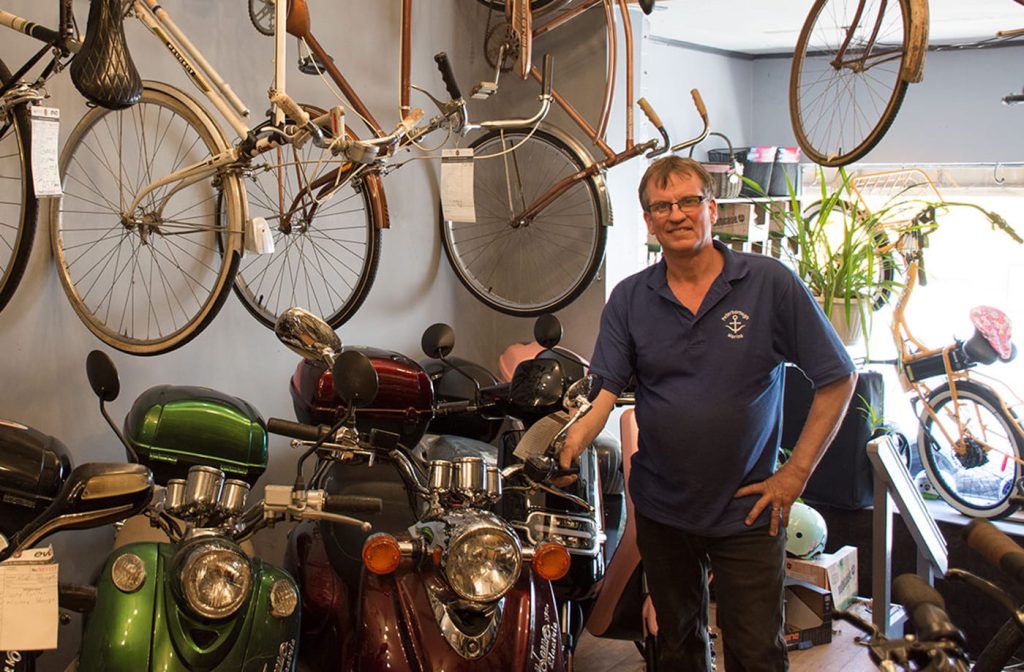 Two local business owners in their shop