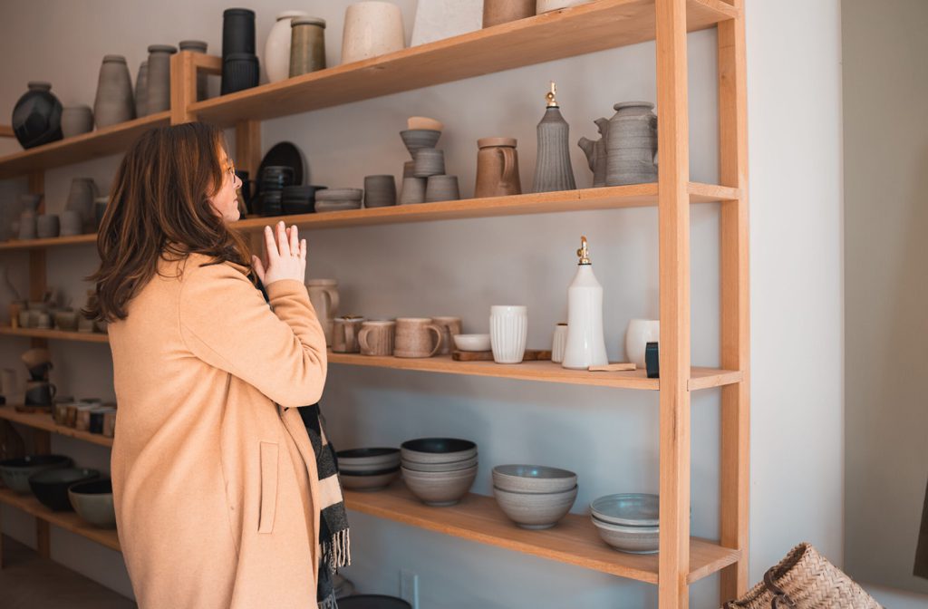 A downtown business owner in their shop